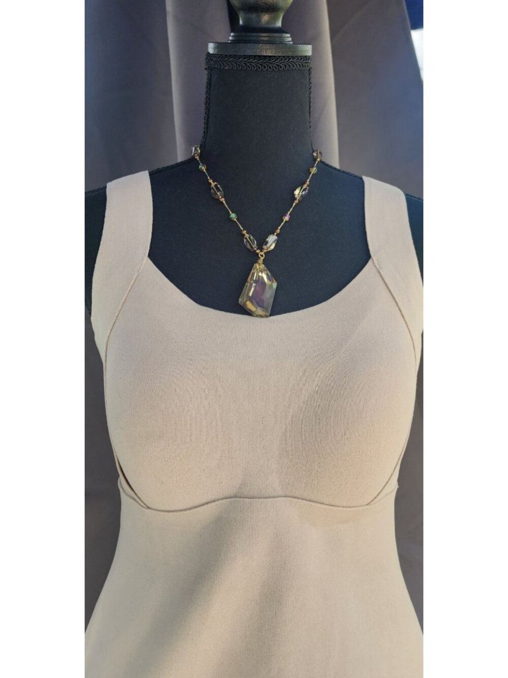 22" Beaded necklace featuring a large crystal pendant